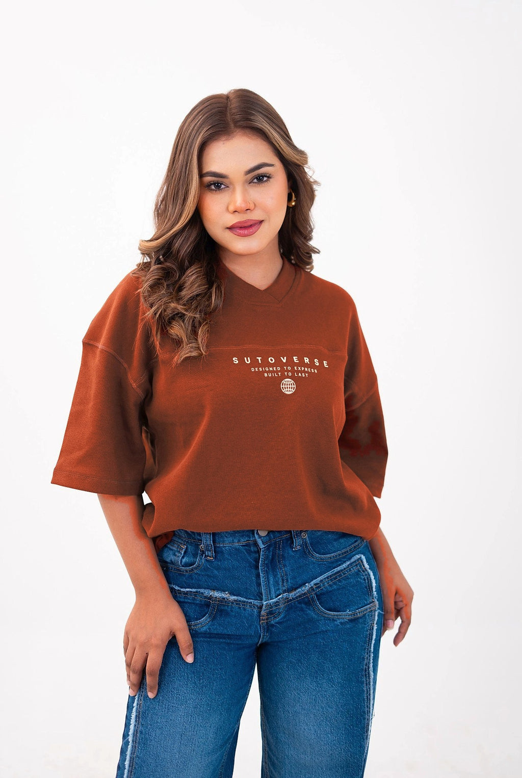 Sutoverse brown oversized drop tee styled with blue frayed jeans, front view